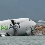 Cargo plane in the sea near Hong Kong airport runway