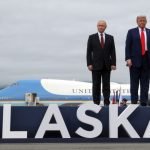 US President Donald Trump and Russian President Vladimir Putin pose for photos.