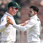 South Africa's Keshav Maharaj (R) celebrates with Simon Harmer after taking the wicket of Pakistan's Saud Shakeel during the second day of the second Test cricket match between Pakistan and South Africa at the Rawalpindi Cricket Stadium in Rawalpindi on October 21, 2025. (Photo by Aamir QURESHI / AFP)