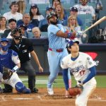 Jays shake off marathon loss, dump Dodgers to even MLB World Series at 2-2 Vladimir Guerrero Jr in action.