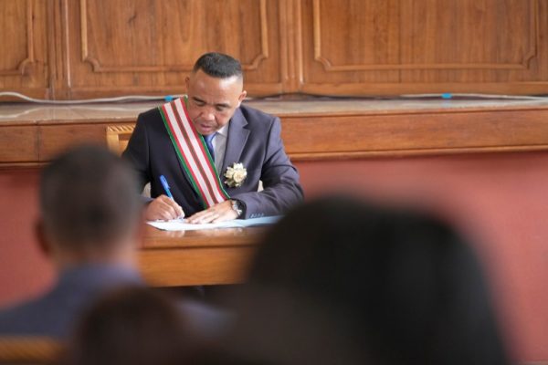 Col. Michael Randrianirina signs documents at the High Constitutional Court after being sworn in as president in Antananarivo, Madagascar on October 17, 2025.