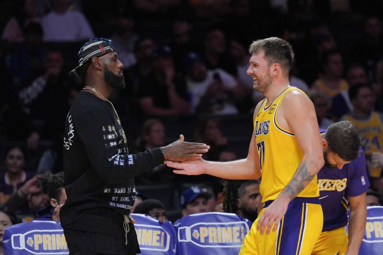 LeBron James and Luka Doncic react.