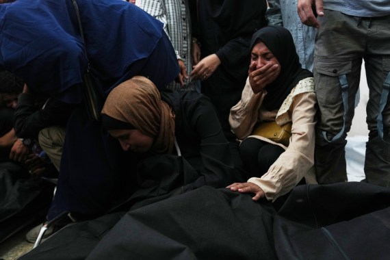 Woman covers her mouth in mourning
