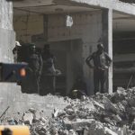 Israel launches heavy bombardment on Gaza City as US says ceasefire holds Members of the al-Qassam Brigades, the military wing of Hamas, along with Egyptian workers and machinery, search for the bodies of hostages in Nuseirat, Gaza Strip, Tuesday, Oct. 28, 2025