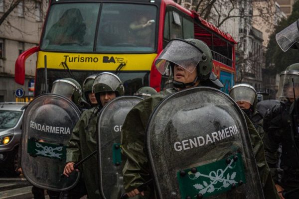 ‘They could have killed me’: Protesters condemn state violence in Argentina Police in riot gear stand in front of a tourism bus in Argentina