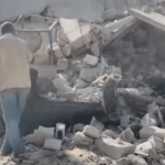 Gaza returnee places family tent over unexploded Israeli bomb Gaza returnee places family tent over unexploded Israeli bomb