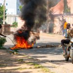 Four killed in Cameroon as protests intensify ahead of presidential results Burning barricades are seen in Garoua during a demonstration by supporters of the political opposition on October 21, 2025 ahead of the release of the results of the presidential vote. (Photo by AFP)