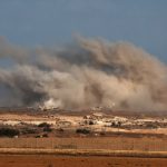 Hamas hands over two Israeli captives’ bodies amid shaky Gaza ceasefire TOPSHOT - This picture taken from a position at Israel's border with the Gaza Strip shows smoke billowing during an Israeli strike on the besieged Palestinian territory on October 30, 2025.