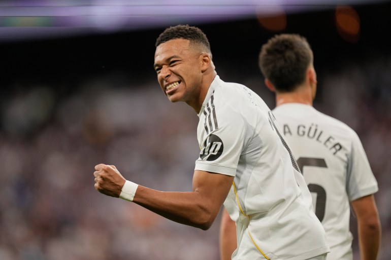 Real Madrid's Kylian Mbappe reacts after scoring during a La Liga soccer match between Real Madrid and Barcelona in Madrid, Spain, Sunday, Oct. 26, 2025. (AP Photo/Bernat Armangue)