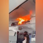 Video: Battery fire on Air China flight's overhead bin sparks panic among flyers