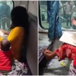 Distressed woman breaks AC coach window after purse theft as child watches on