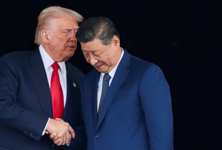 U.S. President Donald Trump and Chinese President Xi Jinping talk as they leave after a bilateral meeting at Gimhae International Airport, on the sidelines of the Asia-Pacific Economic Cooperation (APEC) summit, in Busan, South Korea, October 30, 2025. REUTERS/Evelyn Hockstein TPX IMAGES OF THE DAY