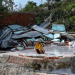 A resident looks on next to the debris of a structure destroyed in high winds in Nhon Hai fishing village near Quy Nhon in the aftermath of Typhoon Kalmaegi in Gia Lai province, central Vietnam on November 7, 2025. [File: NHAC NGUYEN/AFP]