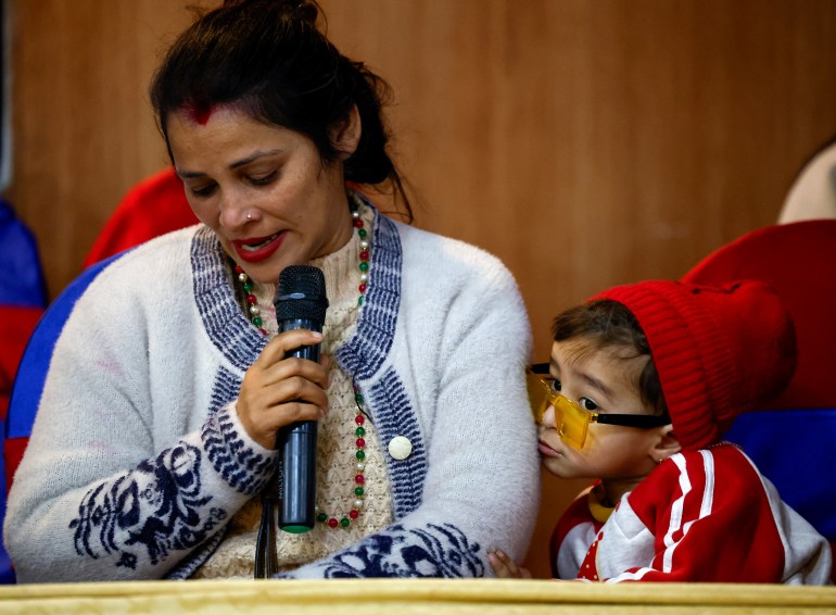 Tina Ghimire, wife of Padam Ghimire, speaks to members of the media about her husband, who is in Russia, as families of Nepali nationals who have been recruited by the Russian army to fight against Ukraine pleaded for their safe return, in Kathmandu, Nepal February 2, 2024. REUTERS/Navesh Chitrakar