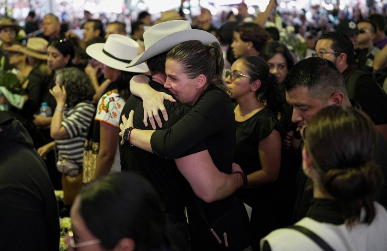 People react during the funeral of Carlos Manzo, the mayor who was shot dead during a Day of the Dead event, in Uruapan, Mexico, November 2, 2025.