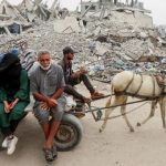 Hamas hands over Israeli soldier’s body as Israeli raids on Gaza continue