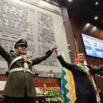 Bolivian President-elect Rodrigo Paz reacts and Vice President-elect Edmand Lara raise their arms Paz's swearing-in ceremony at the Plurinational Legislative Assembly in La Paz, Bolivia, November 8, 2025.