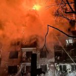 Firefighters work at the site of the apartment building hit by a Russian missile strike, amid Russia's attack on Ukraine, in the town of Balakliia, Kharkiv region