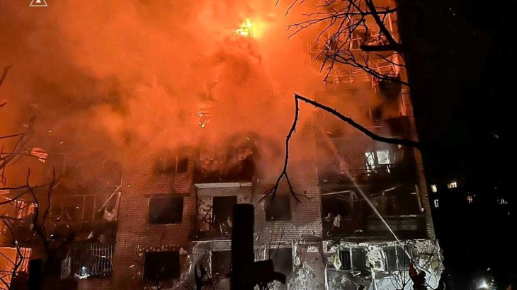 Firefighters work at the site of the apartment building hit by a Russian missile strike, amid Russia's attack on Ukraine, in the town of Balakliia, Kharkiv region