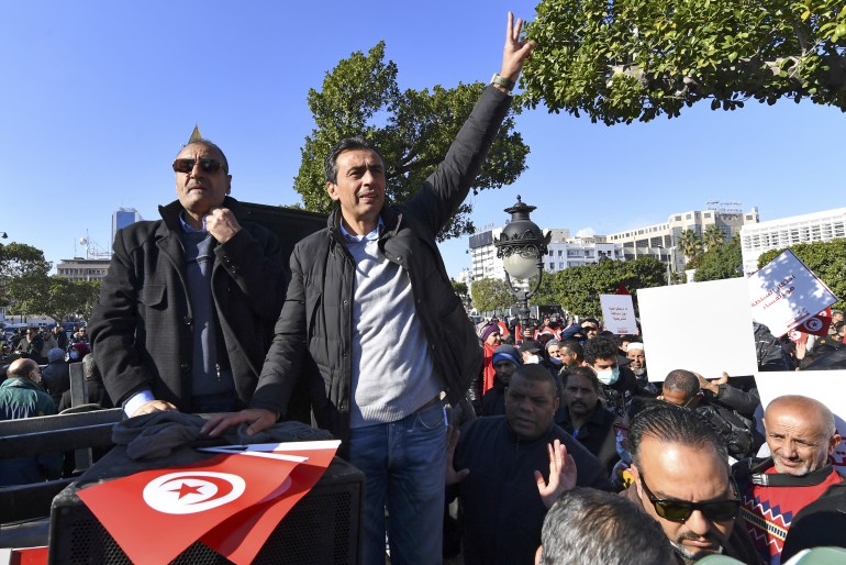 Jawhar Ben Mbarek waves during a demonstration.