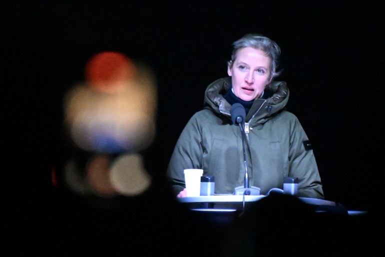 The co-leader of the far-right Alternative for Germany (AfD) party Alice Weidel attends a commemoration after the Christmas market car-ramming attack in Magdeburg, eastern Germany, on December 23, 2024. - Three days after the Magdeburg Christmas market car-ramming attack, both the far-right AfD party and counter-protesters were due to hit the streets in the bereaved city. Magdeburg has been in deep mourning over the mass carnage on Friday evening, December 20, 2024, when an SUV smashed through a crowd at its Christmas market, killing four women and a nine-year-old child and injuring 205 people. Political pressure has built on the question of potential missed warnings about Saudi suspect Taleb al-Abdulmohsen, a 50-year-old psychiatrist who had made online deaths threats and previously had trouble with the law. (Photo by RALF HIRSCHBERGER / AFP)