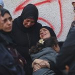Palestinians mourn the death of loved ones killed in overnight Israeli strikes at the Al-Shifa Hospital in Gaza City