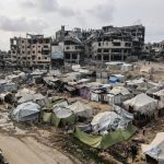Palestinians walk around their tents in Gaza City on November 3, 2025, during a ceasefire in the two-year-long Israeli war on Gaza. [File: Omar Al-Qattaa/AFP]