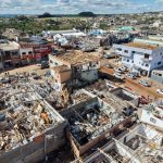 An aerial view shows destruction after a tornado hit the city of Rio Bonito do Iguacu, in Brazil's Parana State, on November 8, 2025. A tornado killed at least six people and injured around 750 as it destroyed most of a town in southern Brazil, authorities said Saturday. The twister on Friday evening flipped cars like toys and wrecked buildings in Rio Bonito do Iguacu, a town of 14,000 people in Parana state, officials said. (Photo by Daniel Castellano / AFP)