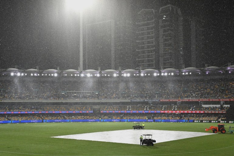 Rain falls during a T20 cricket international between India and Australia in Brisbane, Australia, Saturday, Nov. 8, 2025. (Darren England/AAPImage via AP)