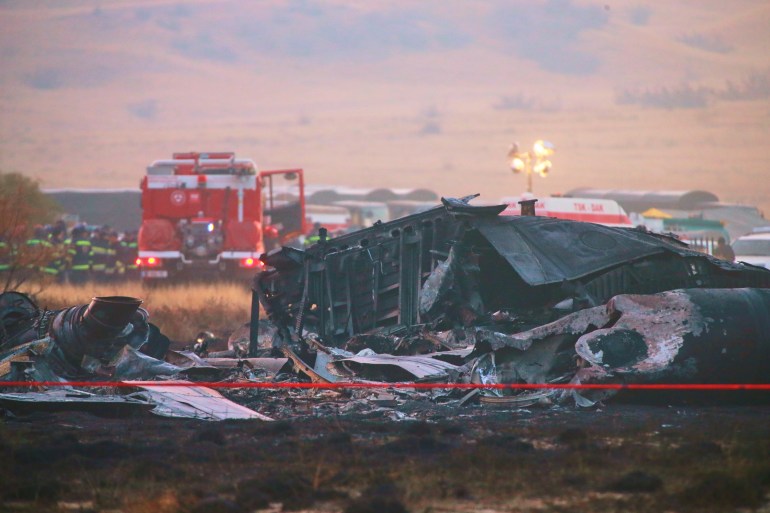 Debris is seen at a crash site of a Turkish military cargo plane in Georgia's Sighnaghi municipality, close to the Azerbaijani border