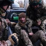 In this photo provided by Ukraine's 93rd Kholodnyi Yar Separate Mechanized Brigade press service, servicemen evacuate their wounded fellow soldier Oleg Solonchak near Kostyantynivka, Donetsk region, Ukraine, Tuesday, Nov. 11, 2025. (Iryna Rybakova/Ukraine's 93rd Mechanized Brigade via AP)