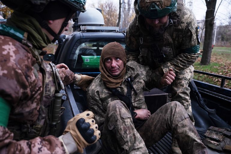 In this photo provided by Ukraine's 93rd Kholodnyi Yar Separate Mechanized Brigade press service, servicemen evacuate their wounded fellow soldier Oleg Solonchak near Kostyantynivka, Donetsk region, Ukraine, Tuesday, Nov. 11, 2025. (Iryna Rybakova/Ukraine's 93rd Mechanized Brigade via AP)