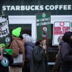 Protesters picket outside a Starbucks in Philadelphia, US