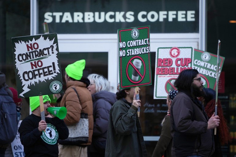 Protesters picket outside a Starbucks in Philadelphia, US