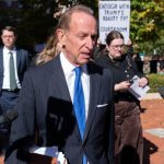 Abbe Lowell leaves the courthouse in Virginia