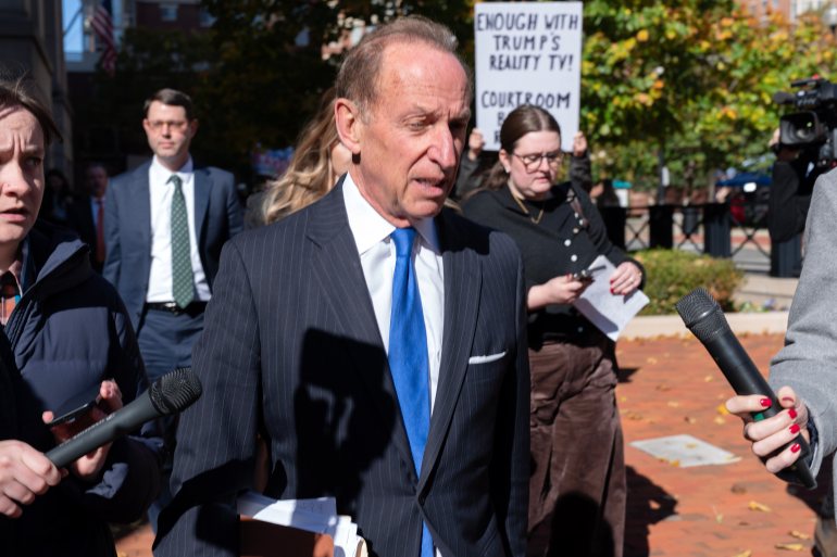 Abbe Lowell leaves the courthouse in Virginia