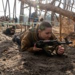 Ukrainian civilians practice on a military training course