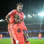 Barcelona's Spanish forward #10 Lamine Yamal (bottom) celebrates with Barcelona's Spanish midfielder #16 Fermin Lopez (top) after scoring the equalizing 2-2 goal during the UEFA Champions League league phase day 4 football match between Club Brugge and FC Barcelona at Jan Breydelstadion stadium, in Bruges, on November 5, 2025. (Photo by NICOLAS TUCAT / AFP)