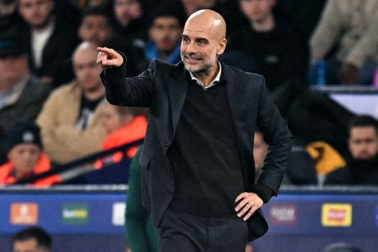TOPSHOT - Manchester City's Spanish manager Pep Guardiola reacts during the UEFA Champions League football match between Manchester City and Borussia Dortmund at the Etihad Stadium in Manchester, north west England, on November 5, 2025. (Photo by Oli SCARFF / AFP)