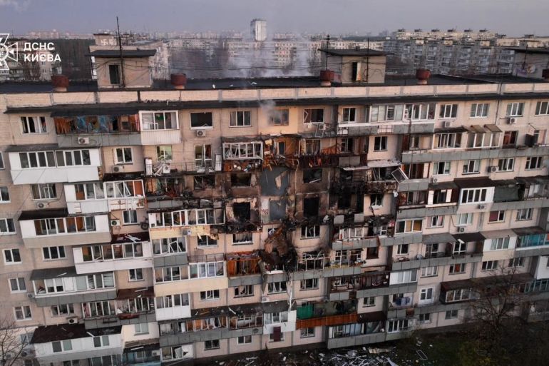 TOPSHOT - This handout photograph taken and released by the Ukrainian Emergency Service on November 14, 2025, shows a damaged residential building following an air strike in Kyiv, amid the Russian invasion of Ukraine.
