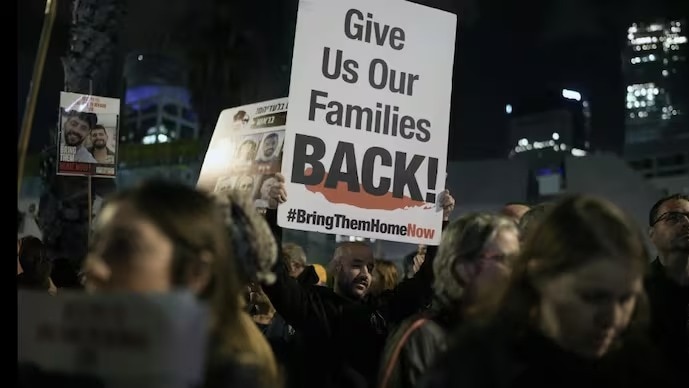 Two coffins of hostages on their way to Israeli troops amid tenuous ceasefire