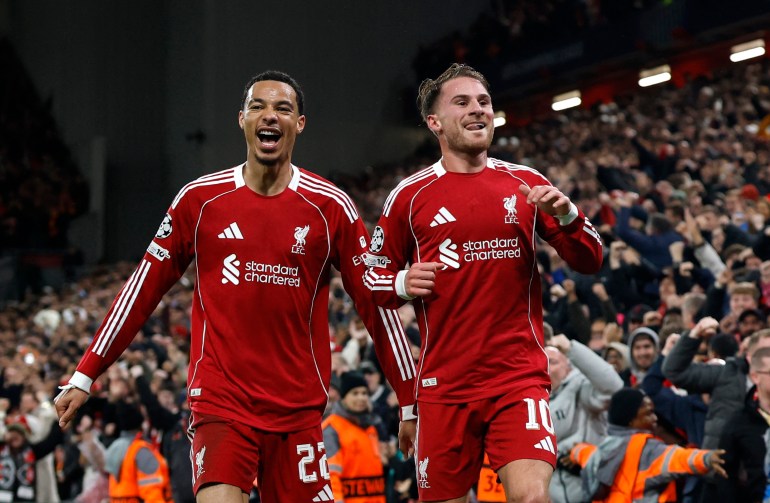 Soccer Football - UEFA Champions League - Liverpool v Real Madrid - Anfield, Liverpool, Britain - November 4, 2025 Liverpool's Alexis Mac Allister celebrates scoring their first goal with Hugo Ekitike Action Images via Reuters/Jason Cairnduff